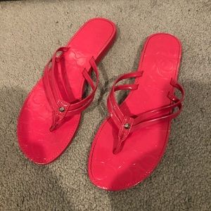 Pink coach flipflops